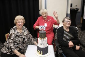 Margaret Norman, Eileen Davis and Jan Pike with 50 year celebration cake